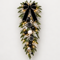 Illuminated black, white and silver Christmas swag concept with black ribbon and coordinated ornament accents
